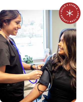Medical Assistant Students practice reading blood pressure