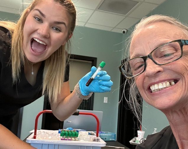 Dental assistant working with patient