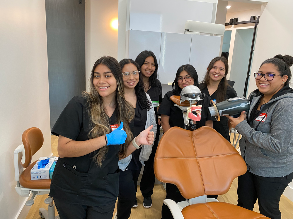 Dental assistant students in a training classroom