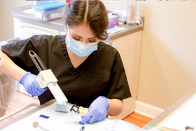 Dental Assistant at lab table