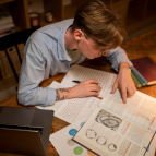 Student in dental office training with their instructor on a patient.